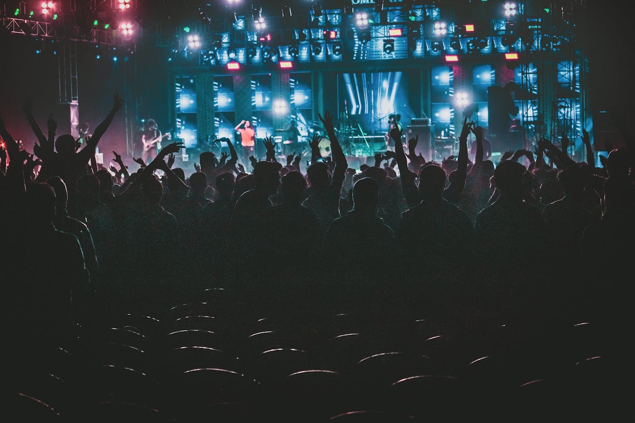 Photo Of People Raising Their Hands Up